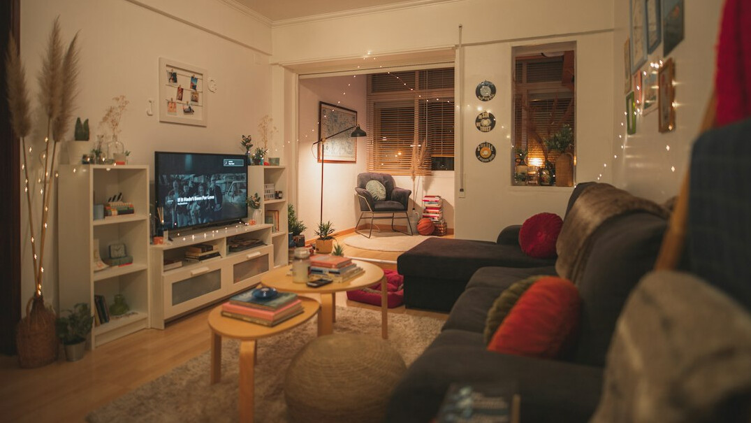 family tidying living room