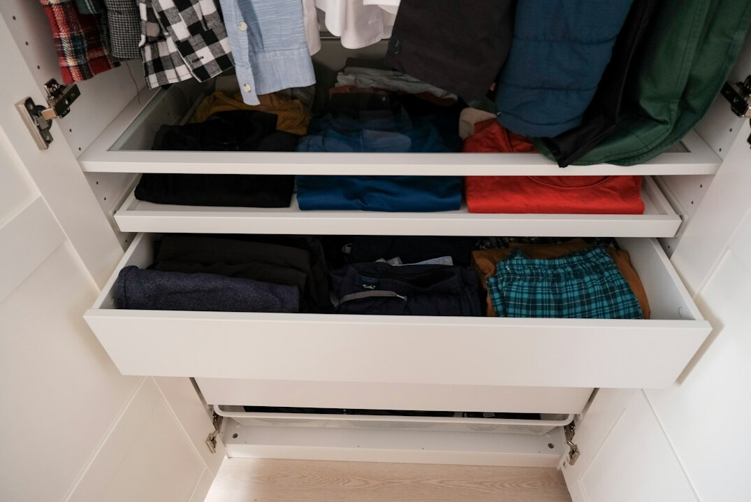 folded sweaters in drawer
