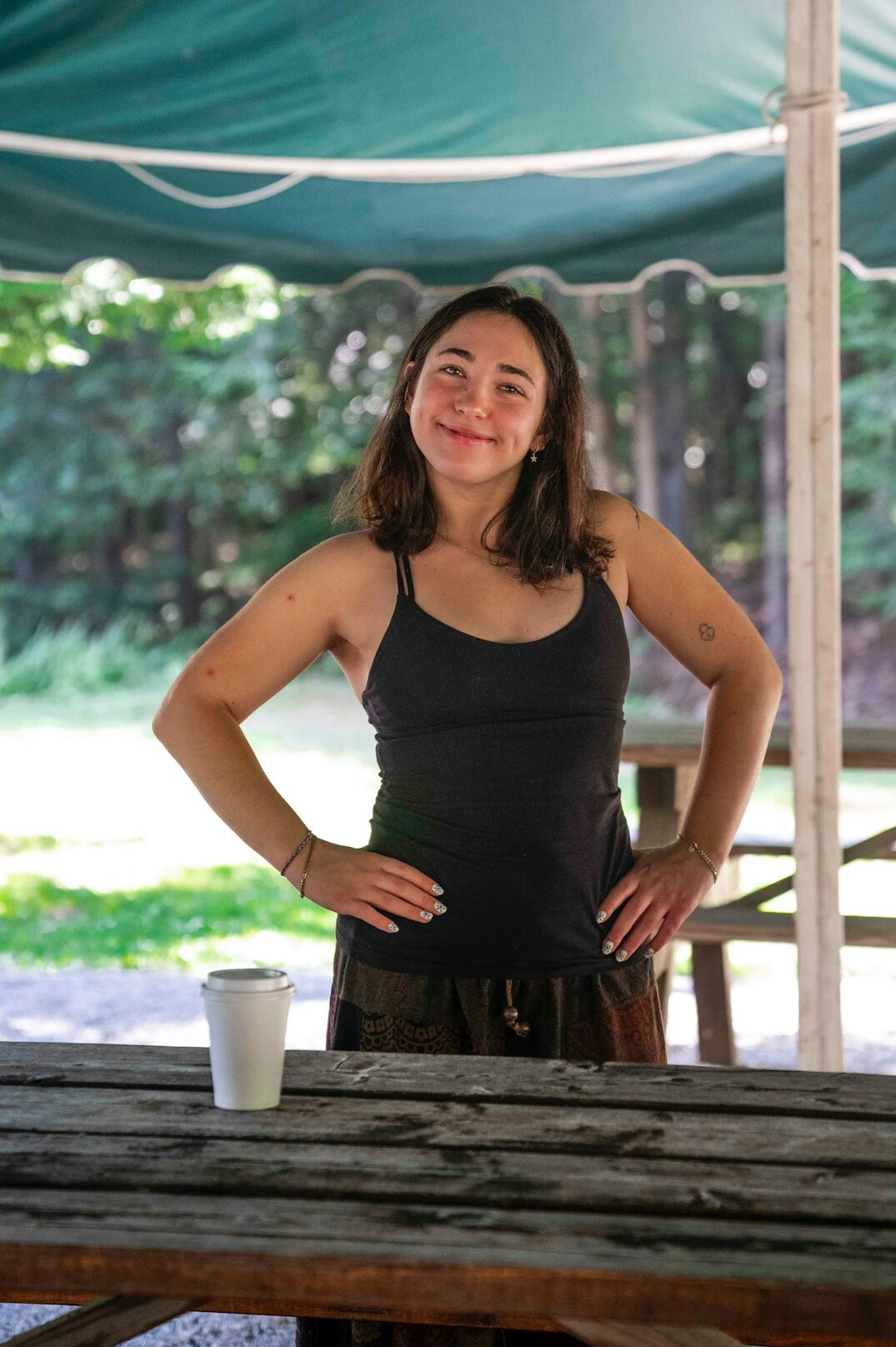 Portrait of a smiling woman in her thirties with dark hair